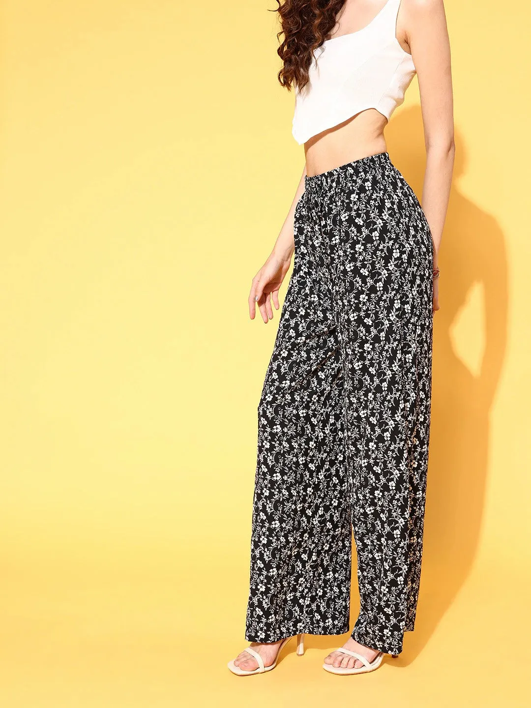 Berrylush Women Black & White Floral Printed High-Rise Waist Wide Leg Flared Trousers